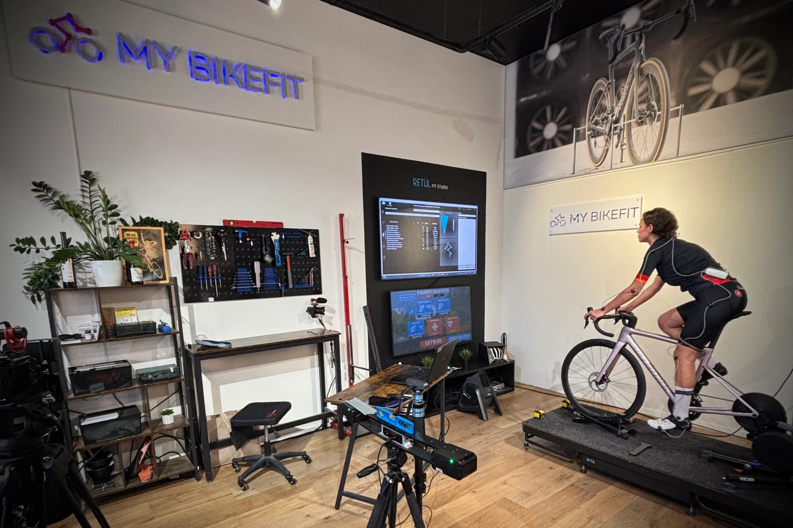 A female cycling going through a Bike Fitting.